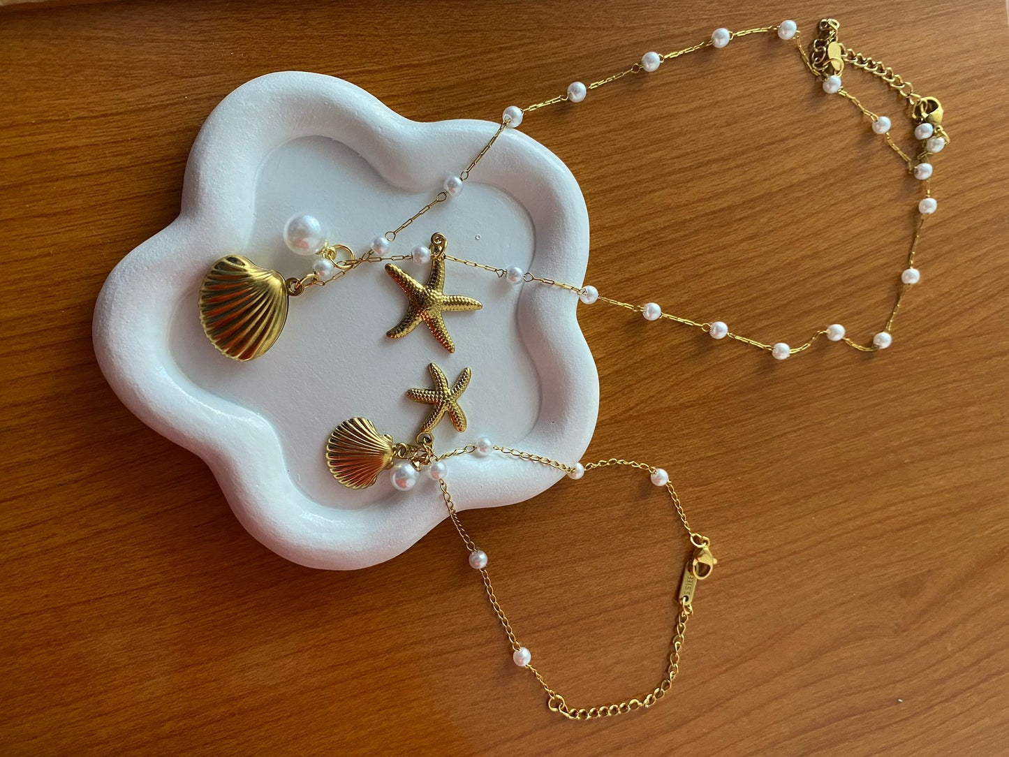 Pulsera y cadena de concha y estrella de mar